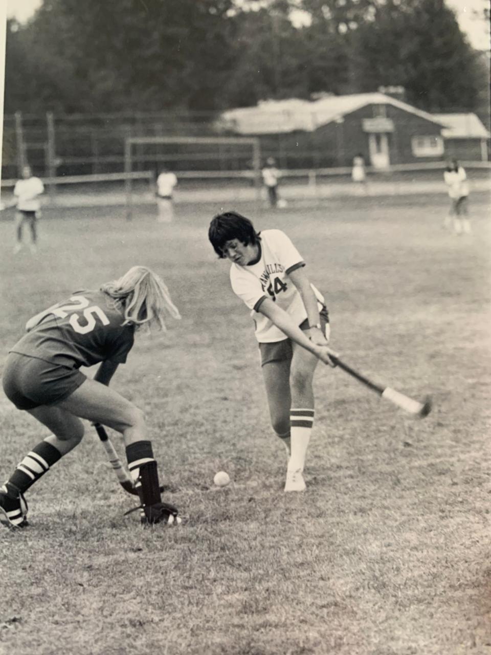 Christine Brennan, right, played six sports in high school, including field hockey.