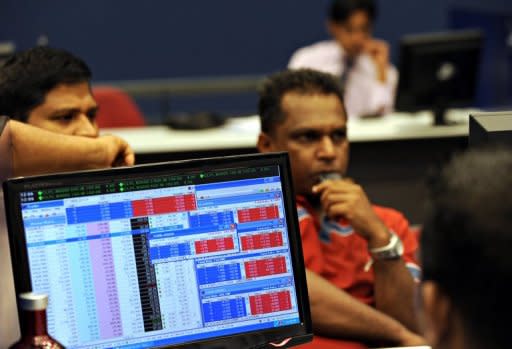 Share traders monitor prices at the Colombo Stock Exchange. Euphoria soon after troops crushed Tamil rebels in May 2009 sparked a bull run which has now been replaced by a search for scapegoats for the loss of over $5 billion in value at the Colombo Stock Exchange within six months