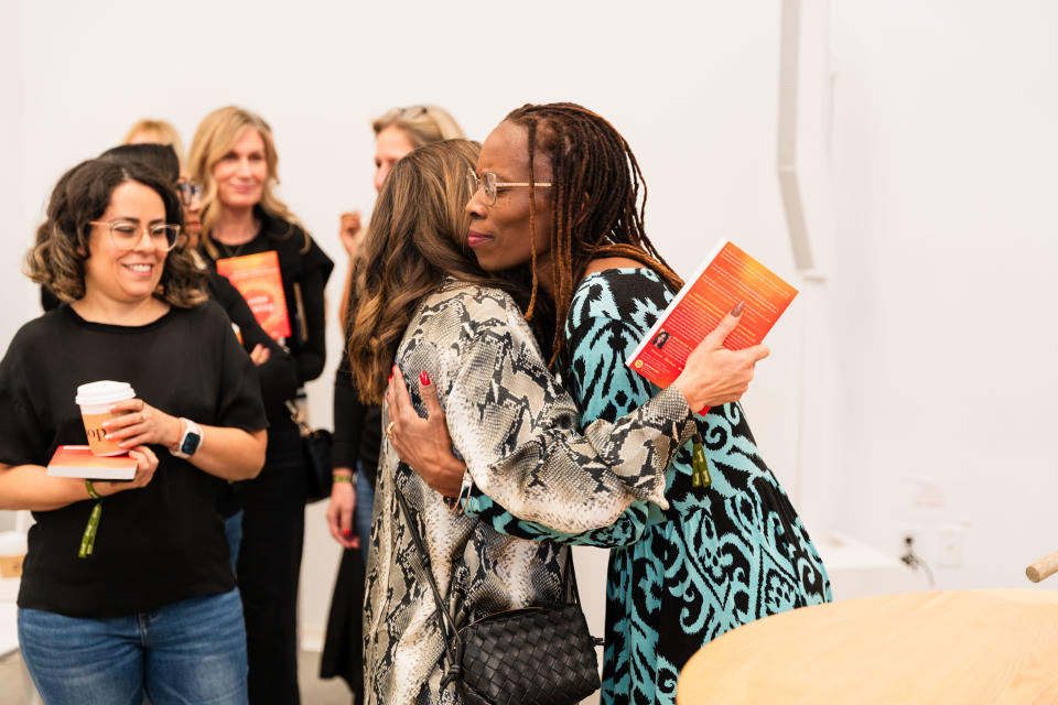 Attendees with speaker Thema Bryant-Davis, psychologist and author of “Homecoming: Overcome Fear and Trauma to Reclaim Your Whole, Authentic Self.”