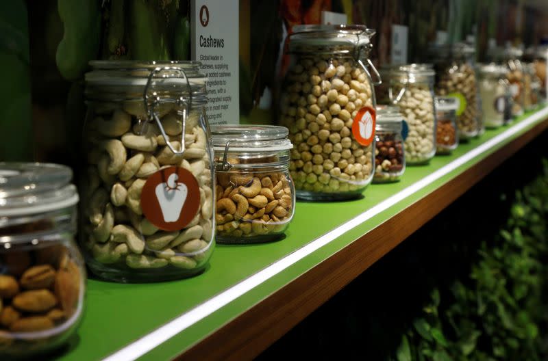 Jars of Olam's products, such as almonds, cashews and peanuts are displayed in their office in Singapore