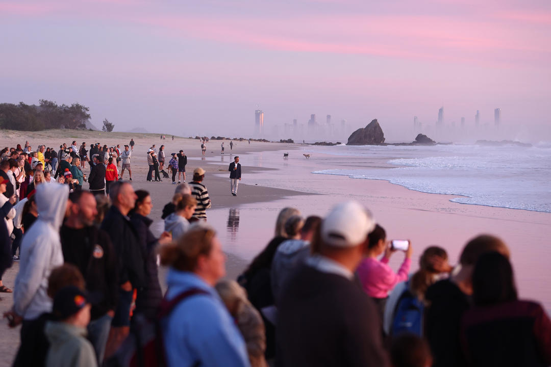 Hundreds look out to the ocean at Currumbin. Source: Getty