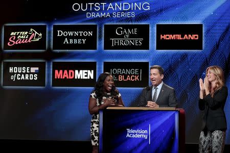 Actresses and nominees Uzo Aduba (L) and Cat Deeley (R) with Television Academy chairman and CEO Bruce Rosenbaum (center) are pictured during the nomination announcements for the 67th Primetime Emmy Awards in West Hollywood, California July 16, 2015. REUTERS/Jonathan Alcorn