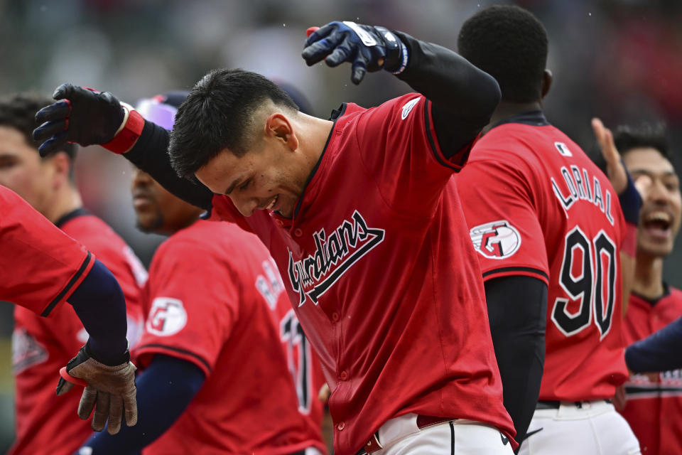 Cleveland Guardians' Andres Gimenez celebrates after hitting a walk-off sacrifice fly in the 10th inning of a baseball game against the New York Yankees, Sunday, April 14, 2024, in Cleveland. (AP Photo/David Dermer)