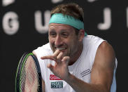 FILE - In this Jan. 28, 2020, file photo, Tennys Sandgren of the U.S. reacts after losing a point to Switzerland's Roger Federer during their quarterfinal match at the Australian Open tennis championship in Melbourne, Australia. Sandgren has reportedly been allowed on an Australia-bound flight despite recently testing positive for coronavirus. (AP Photo/Lee Jin-man, File)