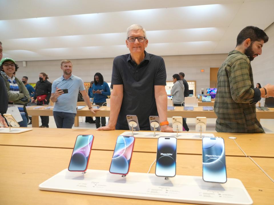 Tim Cook visits an Apple store in New York City on September 16.