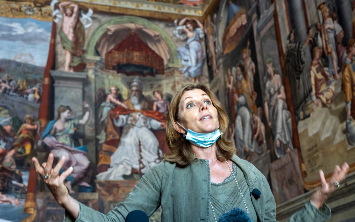 Vatican Museums director Barbara Jatta speaks to the media as she stands in front of Raphael's bare-breasted figure 'Justice' in the Constantine Hall at the Vatican Museums - AP