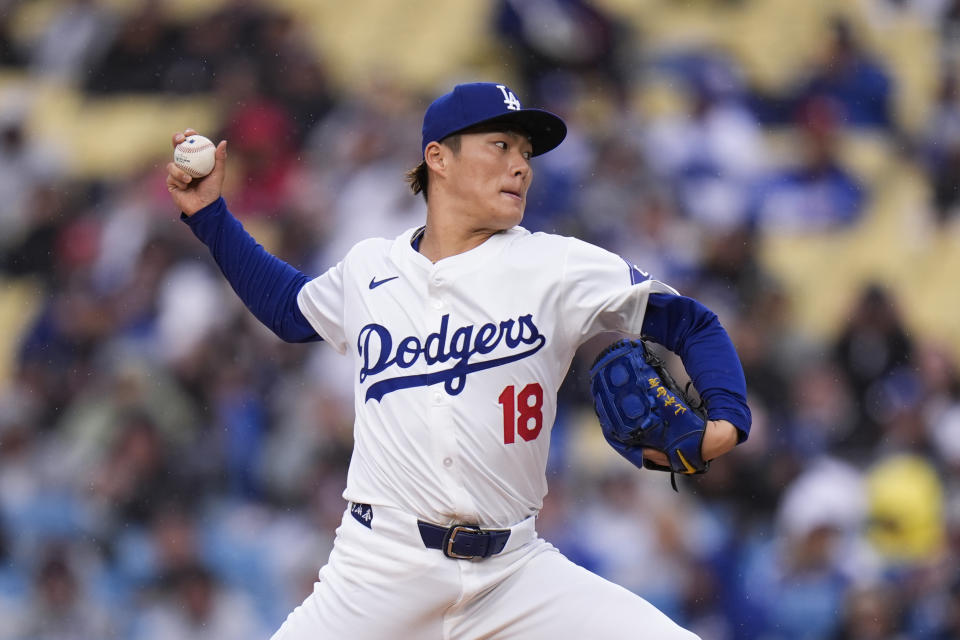 Los Angeles Dodgers starting pitcher Yoshinobu Yamamoto throws against the St. Louis Cardinals during the first inning of a baseball game, Saturday, March 30, 2024, in Los Angeles. (AP Photo/Jae C. Hong)