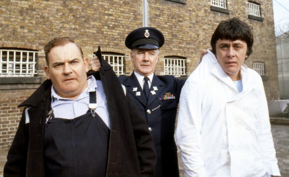 Old lag Fletcher (Ronnie Barker), fellow prisoner Godber (Richard Beckinsale) and prison officer Mackay (Fulton Mackay) during location shooting for the film version of their TV series 