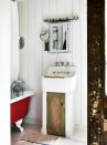 <p>In small bathrooms, hidden storage will be your best friend. This blocky sink offers cupboard space below, with a weathered and worn door for a bit of character.</p>