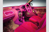 <p>If the Rover 25's exterior was not especially easy on the eye, you'd probably need counselling after being exposed to the interior for too long. With its ornately patterned carpets and door trim inserts, plus lashings of neon pink, the 25's cabin would have overwhelmed <strong>Barbara Cartland</strong>, never mind the young women who MG Rover was trying to target at the time.</p>