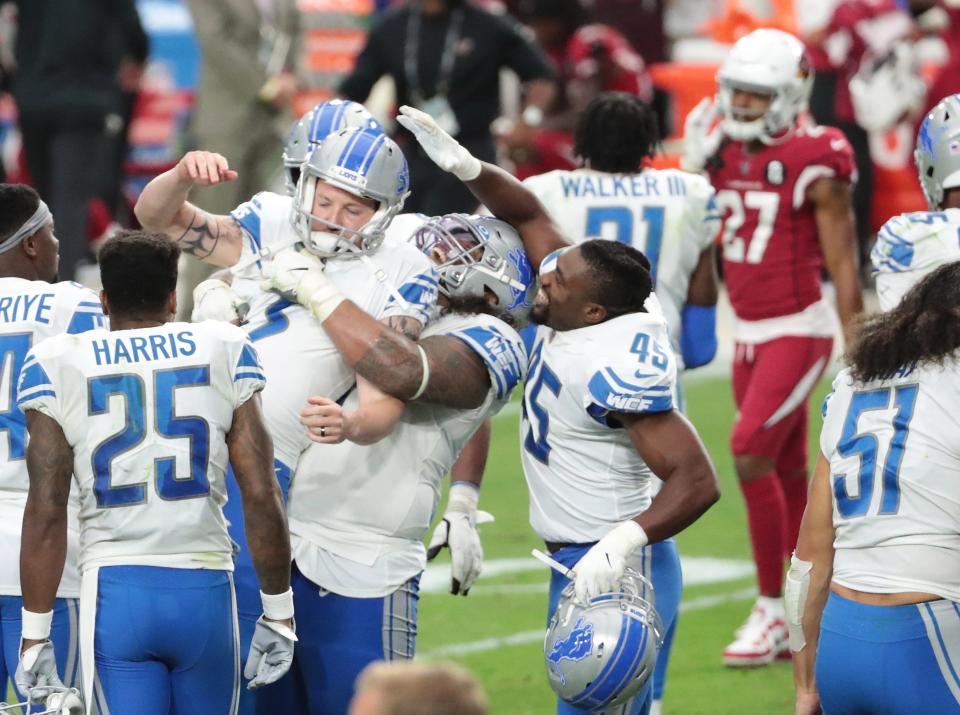 Lions kicker Matt Prater is congratulated by teammates after kicking the winning field goal against the Cardinals during the fourth quarter of the Lions' 26-23 win on Sunday, Sept. 27, 2020, in Glendale, Ariz.