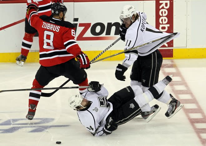  Dainius Zubrus #8 Of The New Jersey Devils Fights For A Loose Puck With Justin Williams #14 And Anze Kopitar #11 Of  Getty Images