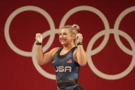 Katherine Elizabeth Nye of the United States celebrates after a lift in the women's 76kg weightlifting event, at the 2020 Summer Olympics, Sunday, Aug. 1, 2021, in Tokyo, Japan. (AP Photo/Luca Bruno)