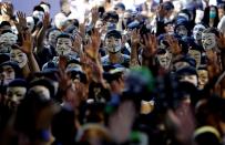 Protesters wearing Guy Fawkes masks attend an anti-government demonstration in Hong Kong