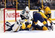 San Jose Sharks right wing Joonas Donskoi (27) attempts to play the puck past Nashville Predators goalie Pekka Rinne (left) during the overtime period in game four of the second round of the 2016 Stanley Cup Playoffs at Bridgestone Arena. Mandatory Credit: Aaron Doster-USA TODAY Sports