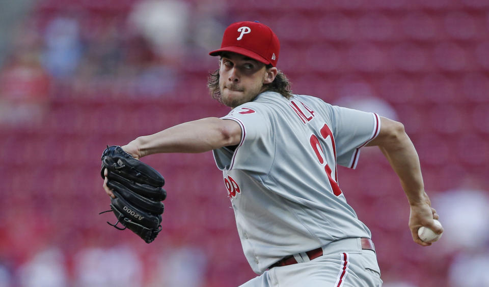 Philadelphia Phillies starting pitcher Aaron Nola works against the Cincinnati Reds during the first inning of a baseball game Wednesday, Sept. 4, 2019, in Cincinnati. (AP Photo/Gary Landers)
