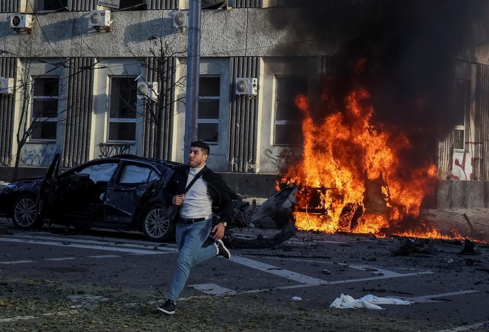 Cars burn after Russian military strike, as Russia's invasion of Ukraine continues, in central Kyiv, Ukraine October 10, 2022.