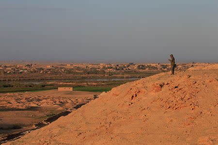 A Popular Mobilisation Forces (PMF) fighter near the Iraqi-Syrian border in al-Qaim, Iraq, November 27, 2018. REUTERS/Alaa al-Marjani