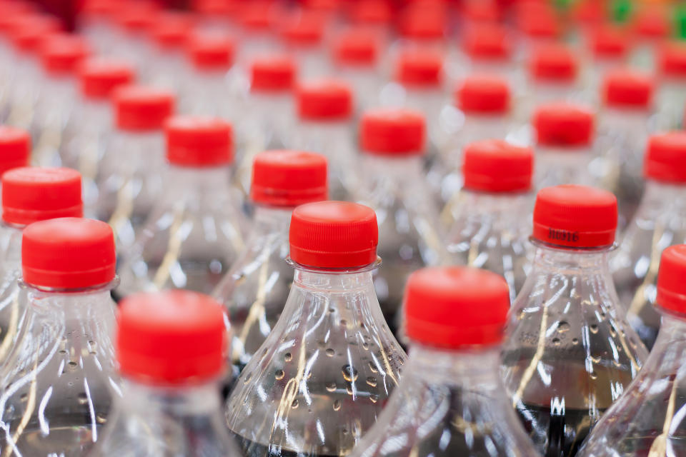 plastic bottles with soft drinks background