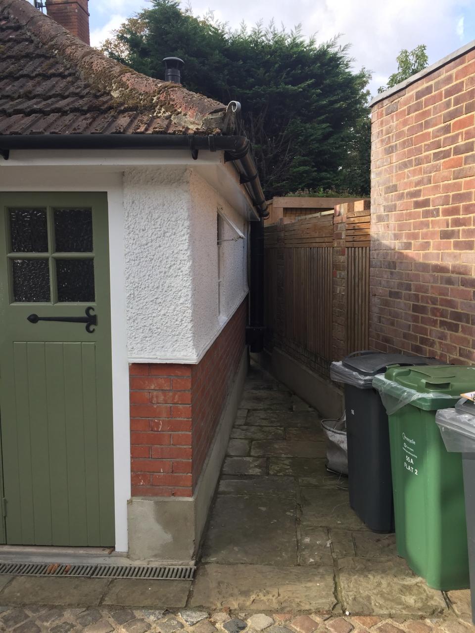 Before: This triangular sliver of pavers was transformed into that perfect washroom.