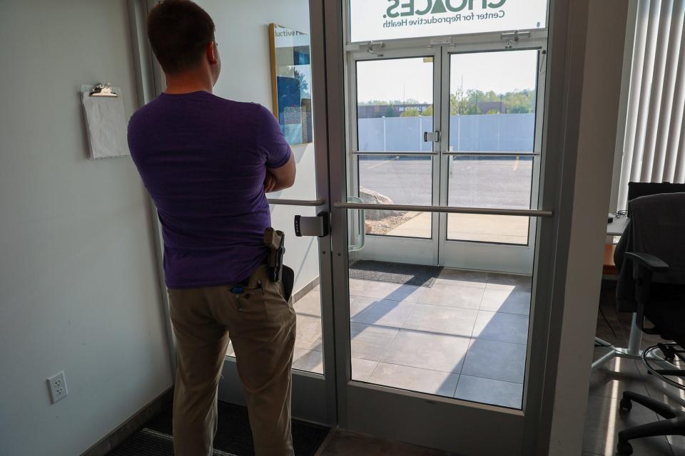 A security guard stands inside Choices Center for Reproductive Health in Carbondale, Illinois. April 2023.