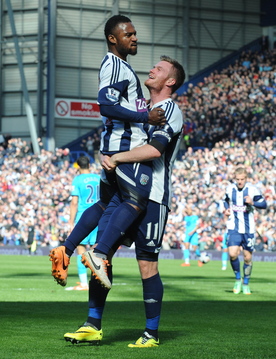 West Brom's Chris Brunt, right, celebrates with Stephane Sessegnon after he scored against Tottenham during the English Premier League soccer match between West Bromwich Albion and Tottenham Hotspur at The Hawthorns Stadium in West Bromwich, England, Saturday, April 12, 2014. (AP Photo/Rui Vieira)