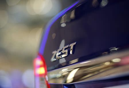 Tata Motors' sedan Zest car is seen on display inside a shopping mall in Gurgoan on the outskirts of New Delhi July 18, 2014. REUTERS/Anindito Mukherjee