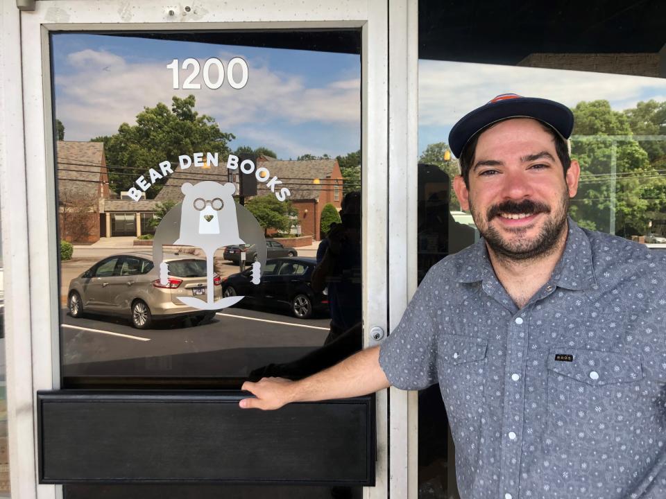 Taylor Fry stands in front of the Bear Den Books independent bookstore on June 28, 2022. He and longtime friend Nick Wendel recently opened the store on Kenesaw Avenue in the heart of Sequoyah Hills.