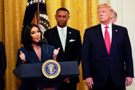 FILE PHOTO: Kardashian joins Trump onstage to speak about second chance hiring, at the White House in Washington