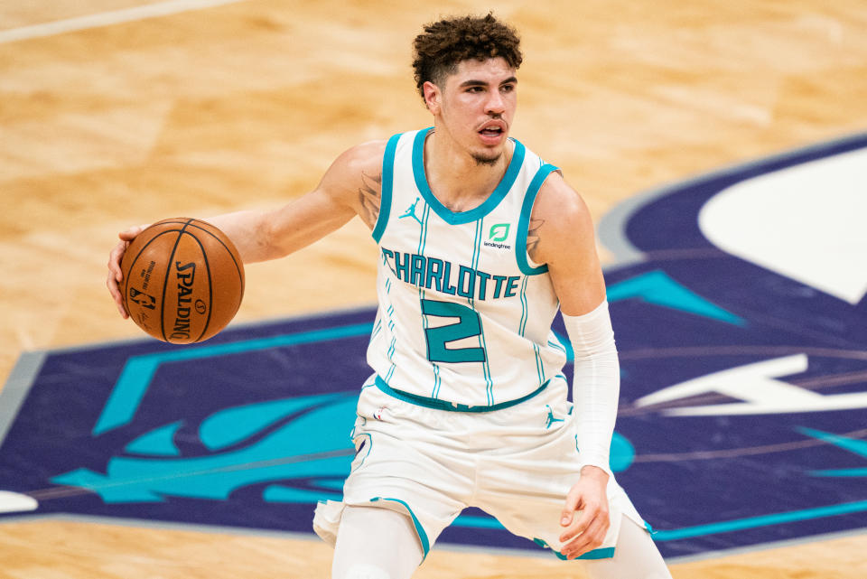 LaMelo Ball brings the ball up court against the Sacramento Kings.