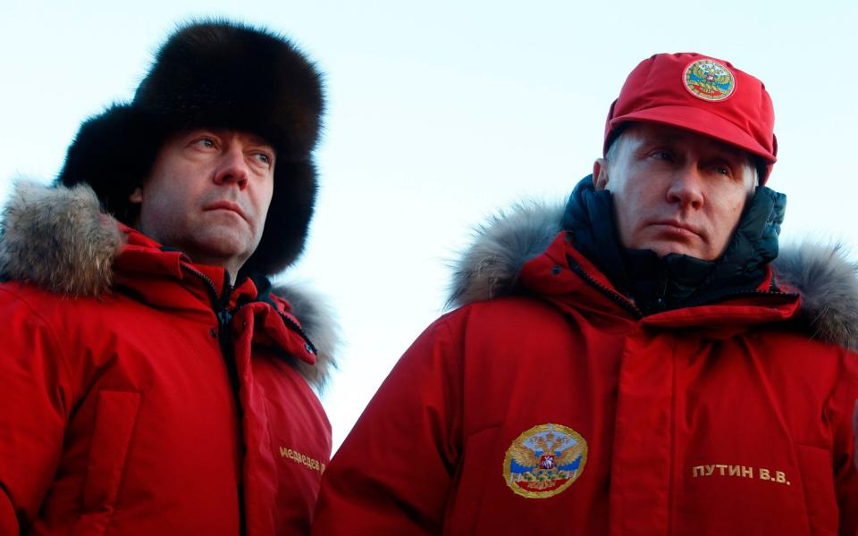 Russian President Vladimir Putin and Prime Minister Dmitry Medvedev visit Alexandra Land in the remote Arctic islands of Franz Josef Land - Credit: AFP/Getty Images