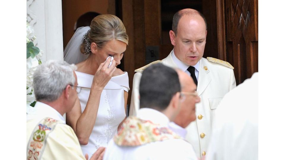 Princess Charlene wipes away a tear at royal wedding