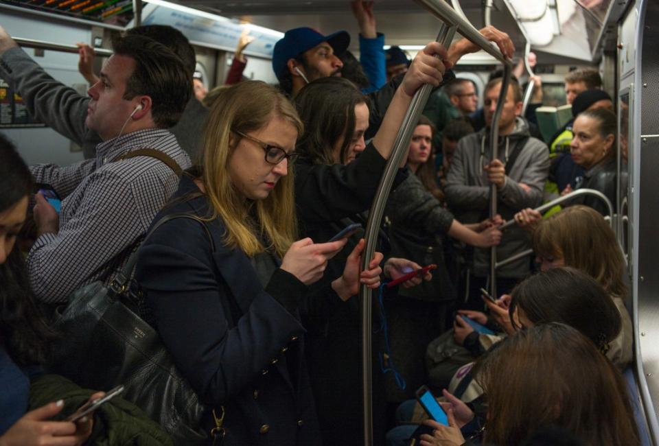 The DOE found that folks in New York spend an average of 33.2 minutes commuting to work each day. Getty Images