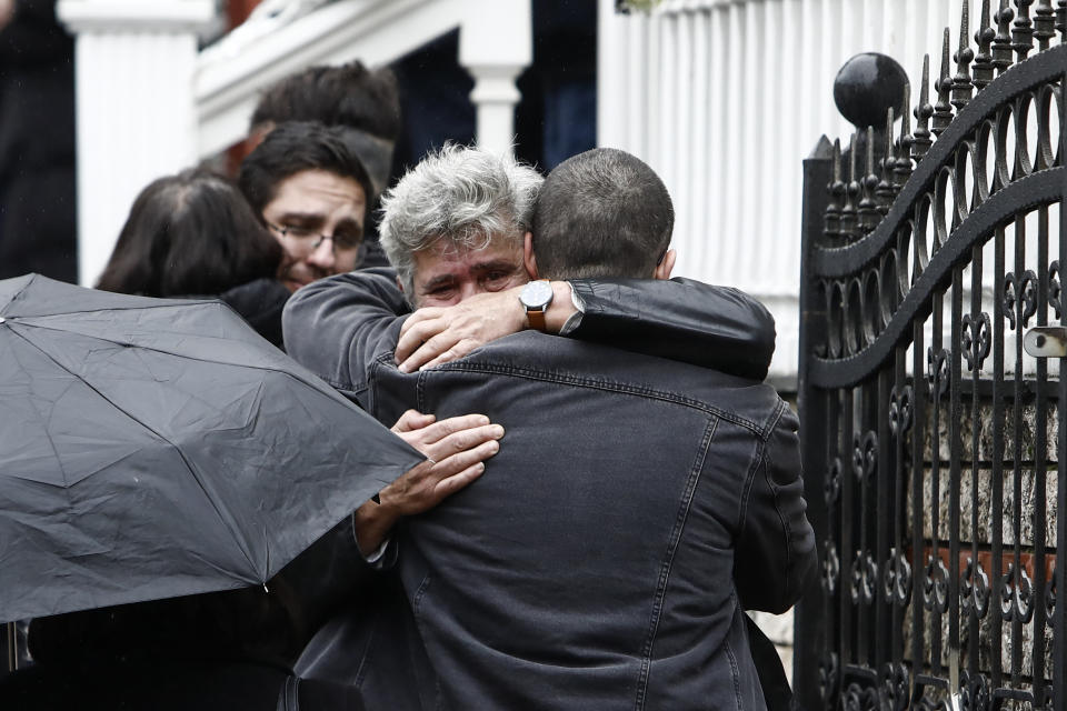 Mourners hug each other during the funeral of 23-year old Ifigenia Mitska, at Giannitsa town, northern Greece, Saturday, March 4, 2023. Over 50 people — including several university students — died when a passenger train slammed into a freight carrier just before midnight Tuesday. The government has blamed human error and a railway official faces manslaughter charges. (AP Photo/Giannis Papanikos)