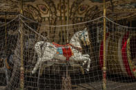 A closed carousel due to the COVID-19 pandemic in Madrid, Spain, Wednesday, May 27, 2020. Spain has become the first western Europe to accumulate more than 1 million confirmed infections as the country of 47 million inhabitants struggles to contain a resurgence of the coronavirus. (AP Photo/Bernat Armangue)
