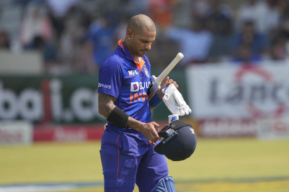 Indian batsman Shikhar Dhawan walks off the pitch after being dismissed on the second day of the One-Day International cricket match between Zimbabwe and India at Harare Sports Club in Harare, Zimbabwe, Saturday, Aug. 20, 2022. (AP Photo/Tsvangirayi Mukwazhi)