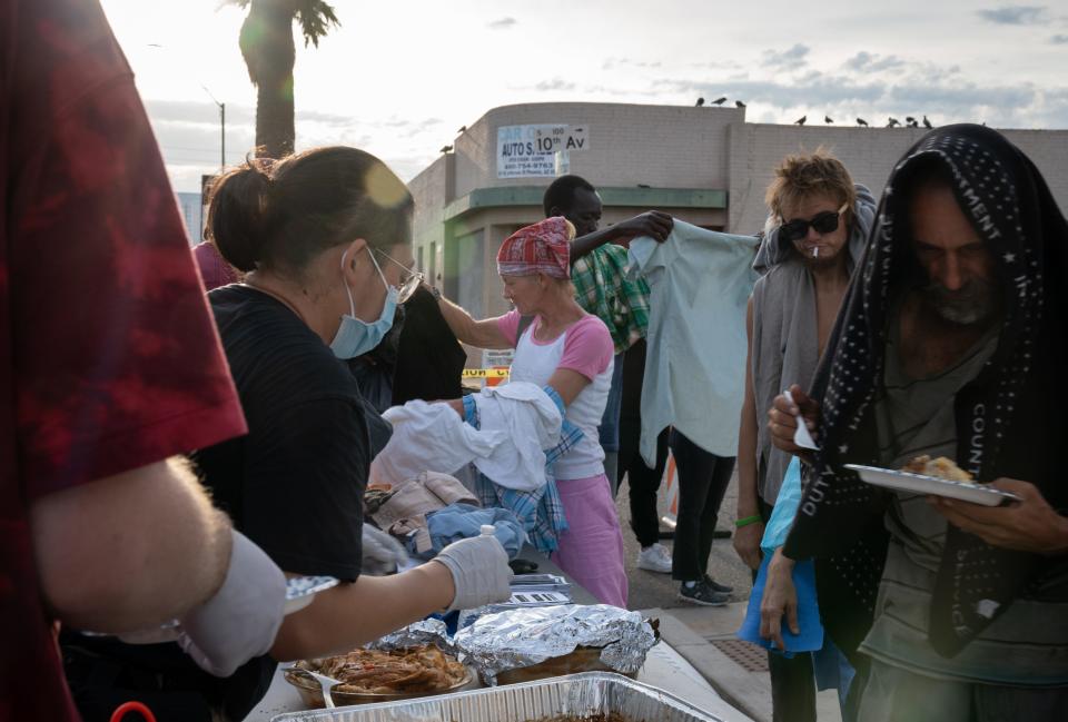 Homeless activists served breakfast and gave out clothing, Sept. 1, 2023, at Jefferson Street and 10th Avenue in Phoenix.