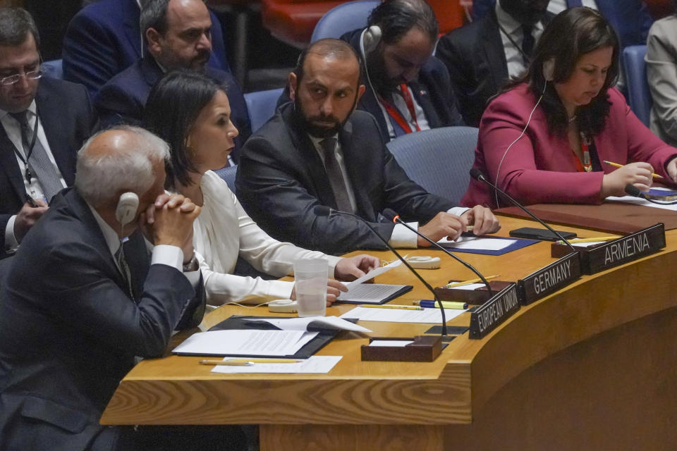 Armenia's Foreign Minister Ararat Mirzoyan, center, listen as Germany's Foreign Minister Annalena Baerbock, second from left, as she address a United Nations Security Council meeting on the conflict between Armenia and Azerbaijan, Thursday Sept. 21, 2023, at the United Nations headquarters. (AP Photo/Bebeto Matthews)