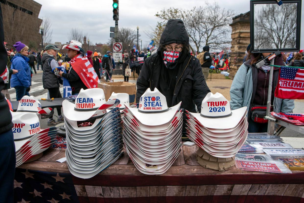 Hats with Trump signs are seen as people attend a rally in support of President Donald Trump on Wednesday, Jan. 6, 2021, in Washington.