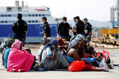 Migrants rests after disembarking from Dignity ship in the Sicilian harbour of Augusta, Italy, October 19, 2016. REUTERS/Antonio Parrinello