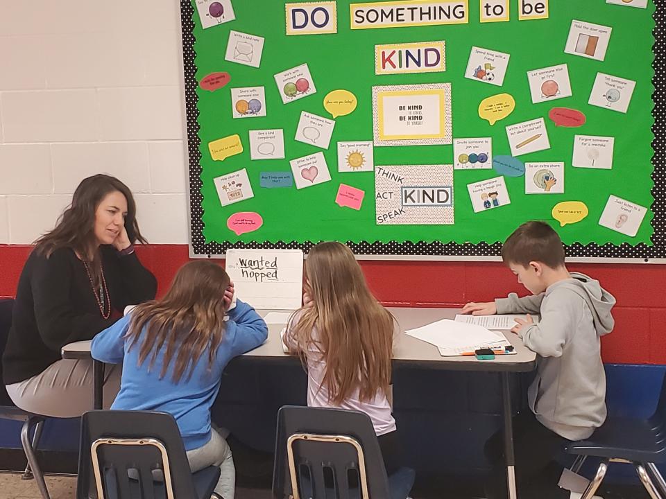 Amber Gibson works with students in her classroom at Lakewood's Jackson Intermediate School.