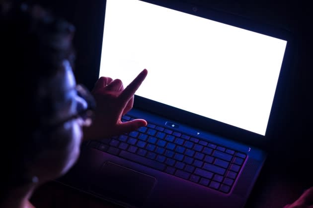 woman accessing the computer with white screen to add an interesting interface - Credit: Getty Images