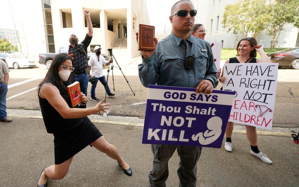 Anti-abortion and pro-choice campaigners in Jackson, Mississippi - Rogelio V. Solis/AP