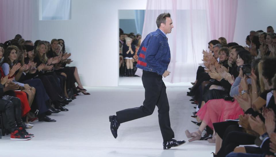 FILE - This Sept. 28, 2012 file photo shows Belgian fashion designer Raf Simons at the end of his Dior ready to wear Spring-Summer 2013 collection in Paris, Friday. Simons is the Creative Director at Christian Dior. (AP Photo/Jacques Brinon)