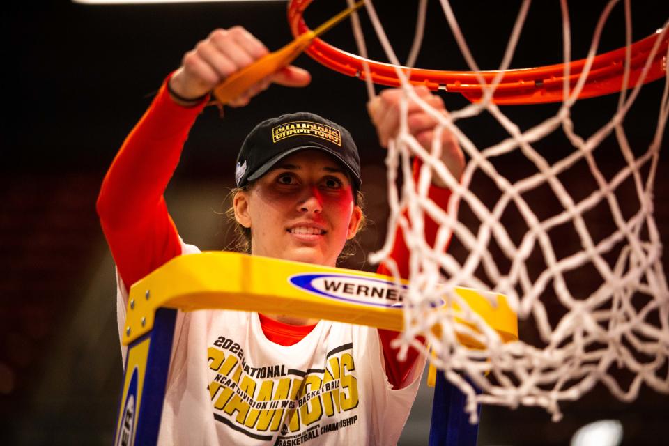 Hope's Olivia Voskuil cuts down the net after becoming a national champion Saturday, March 19, 2022, at UPMC Cooper Fieldhouse in Pittsburgh. 