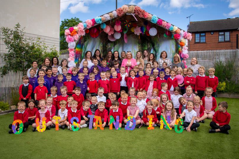 Teachers and children at the school pictured together