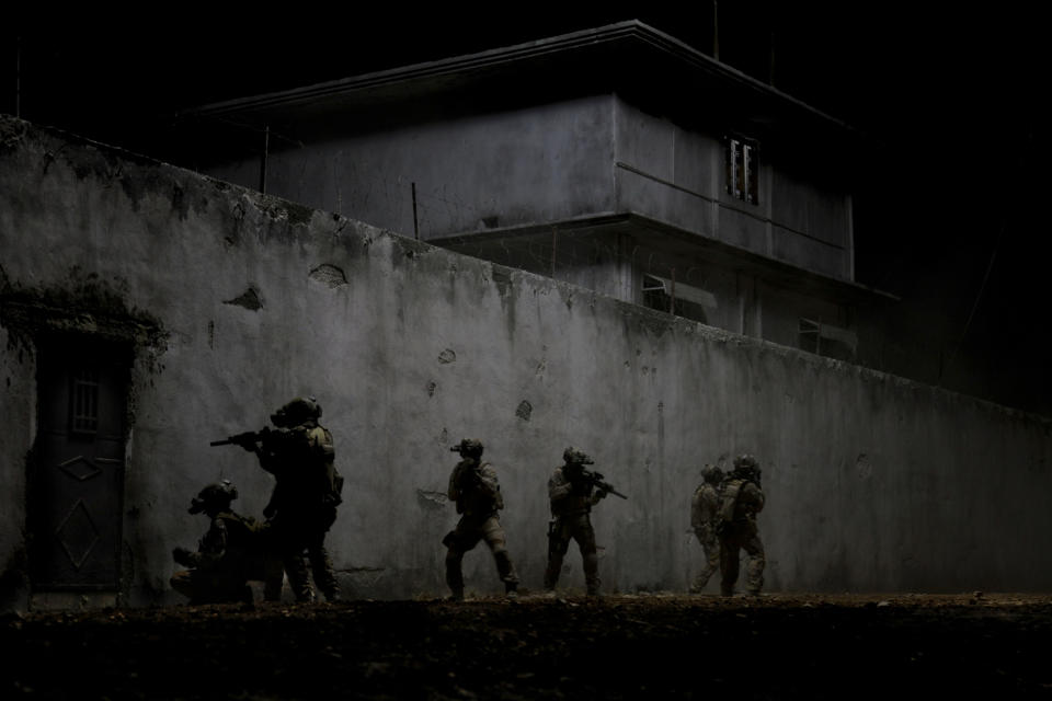 FILE - This undated publicity film image provided by Columbia Pictures Industries, Inc. shows elite Navy SEALs raiding Osama Bin Laden's compound in the dark night in Columbia Pictures' gripping new thriller directed by Kathryn Bigelow, "Zero Dark Thirty." Bigelow's Osama bin Laden thriller "Zero Dark Thirty," Steven Spielberg's Civil War epic "Lincoln" and Christopher Nolan's superhero tale "The Dark Knight Rises" are among the American Film Institute's top-10 movies of the year., announced on Monday, Dec. 10, 2012. (AP Photo/Columbia Pictures Industries, Inc., Jonathan Olley, File)