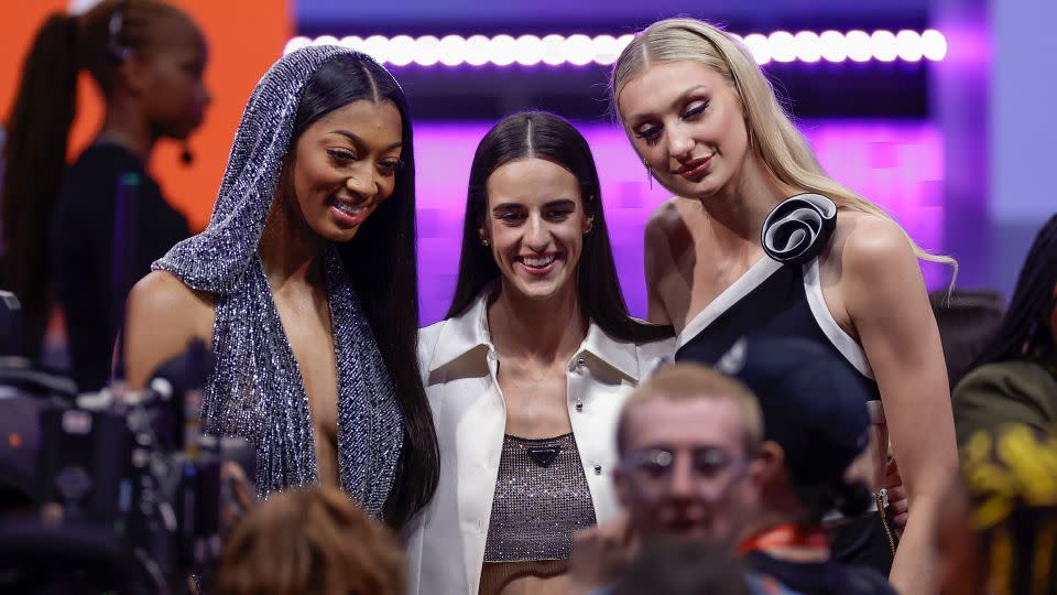 From left, Reese, Caitlin Clark and Stanford's Cameron Brink pose for a photo before the start of the WNBA draft. - Adam Hunger/AP