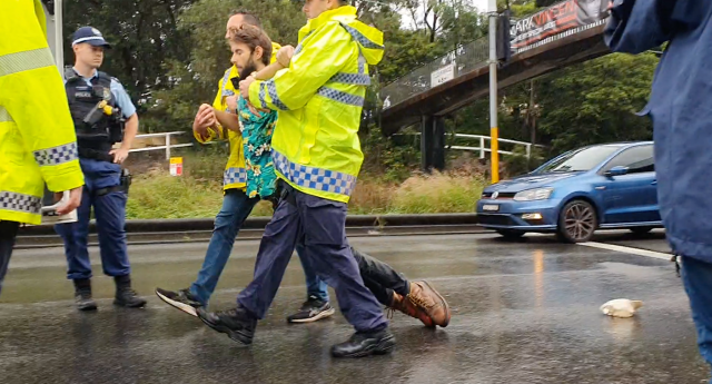 A protester is taken into police custody on Friday. Source: Supplied / Fireproof Australia