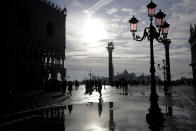 Water starts rising again in Venice, Italy, Saturday, Nov. 16, 2019. High tidal waters returned to Venice on Saturday, four days after the city experienced its worst flooding in 50 years. (AP Photo/Luca Bruno)